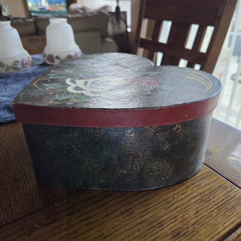 Folk Art Painted Heart Shaped Box With A Christmas Bell Painted On Top.